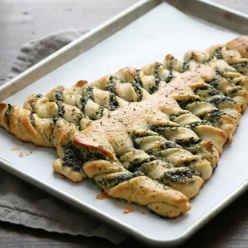 Golden christmas tree spinach dip breadsticks brushed with glossy garlic herb butter and stuffed with creamy cheese filling.