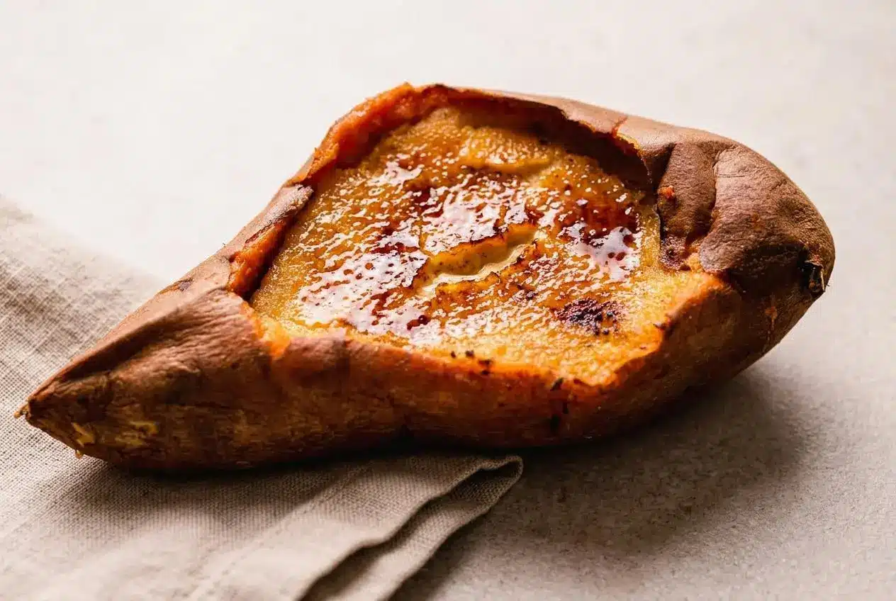 Finished sweet potato creme brulee recipe baked in an edible shell with a glossy caramelized sugar crust